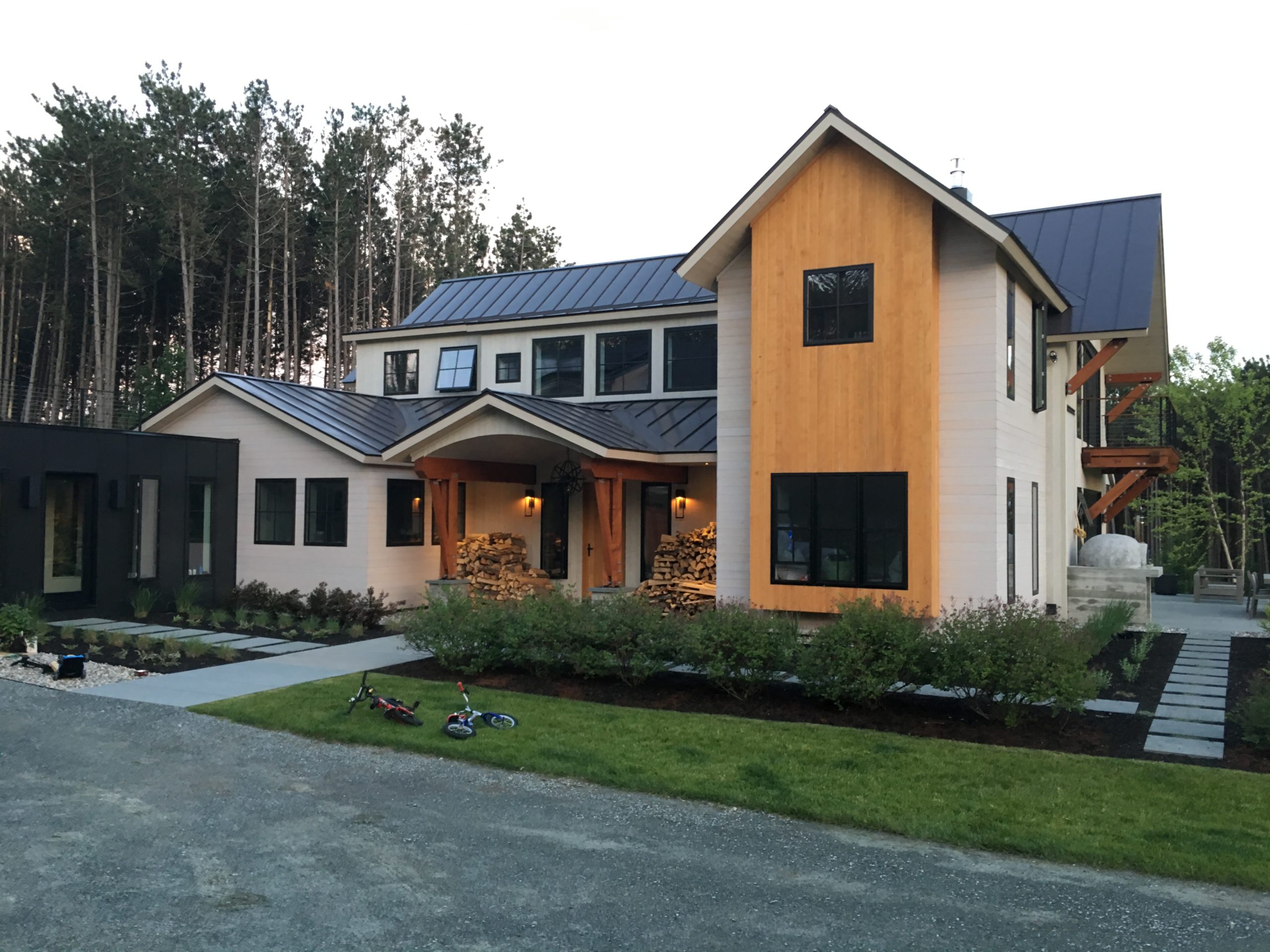 Finished exterior of a timber frame home that had wall SIPs installed.