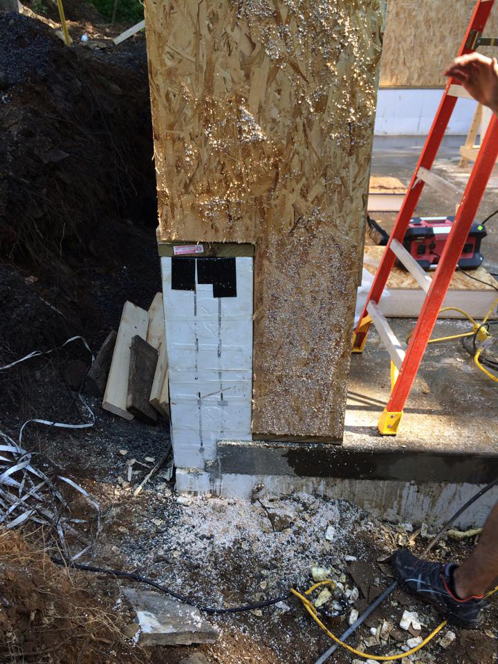 SIPs cut onsite to fit a notched wall for a structural panel garage in New York