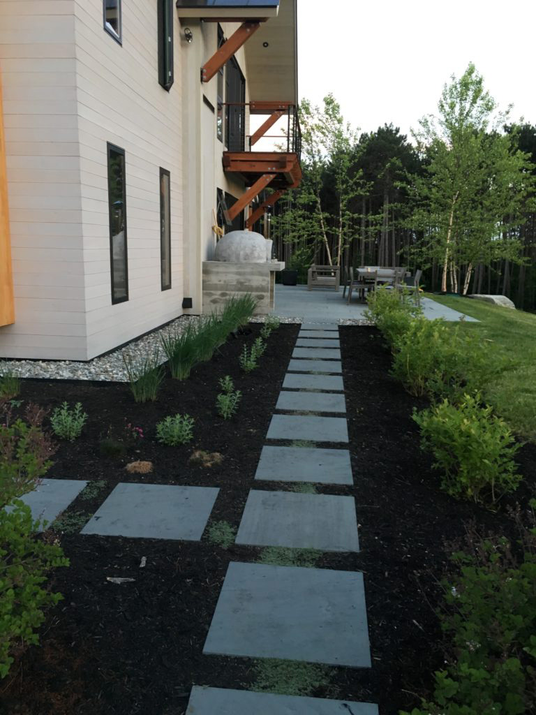 Walkway on the side of a finished home.