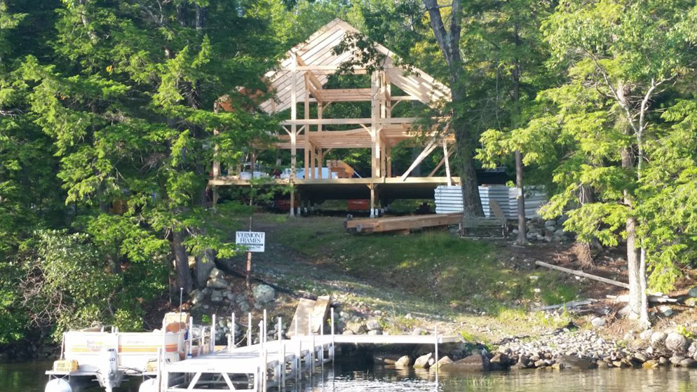 Erected timber frame on the shore of Lake Winnipesaukee