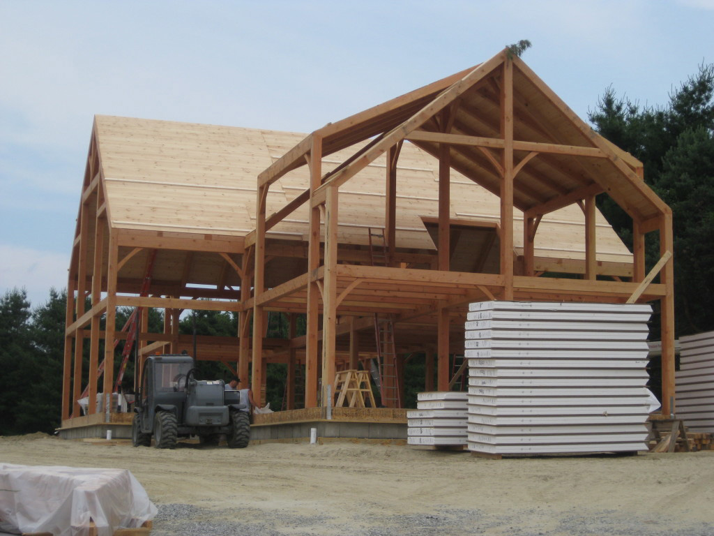 Timber frame structure and stacks of SIPs
