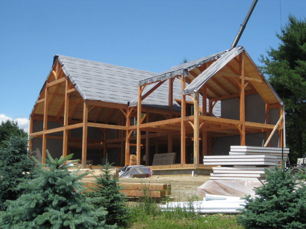 Timber frame structure and stacks of SIPs